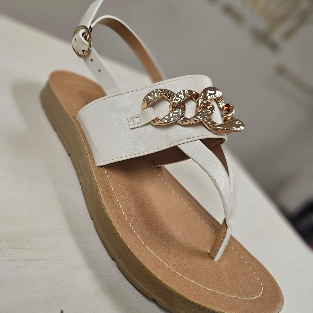 Soda brand Avril sandals. White thong sandals with gold chain detail across top!